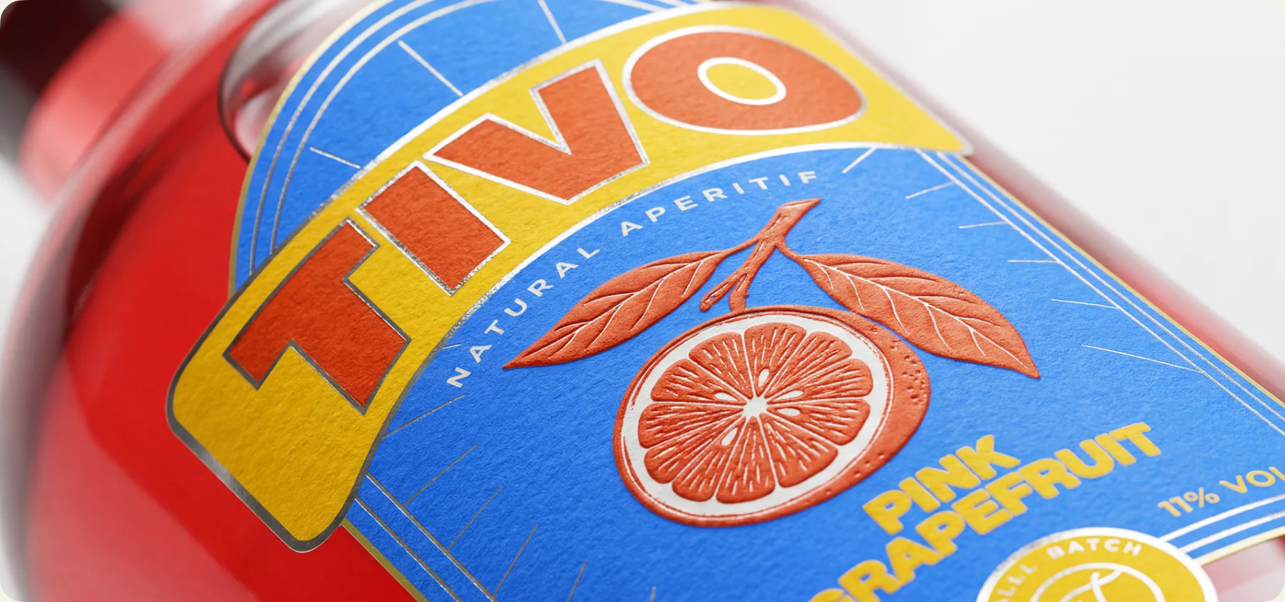 Final Tivo bottles — three flavours together with the finished labels, foil catching the light