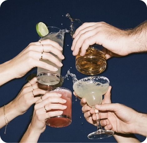 Cocktail toast with hands holding margaritas — Verdadero Tequila campaign image by CreativeWise