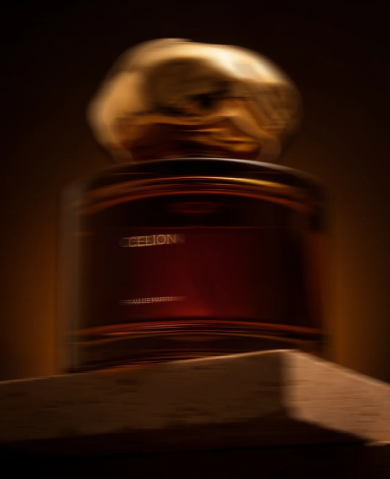 Celion — the deep-red Celion bottle on a wooden surface in low amber light