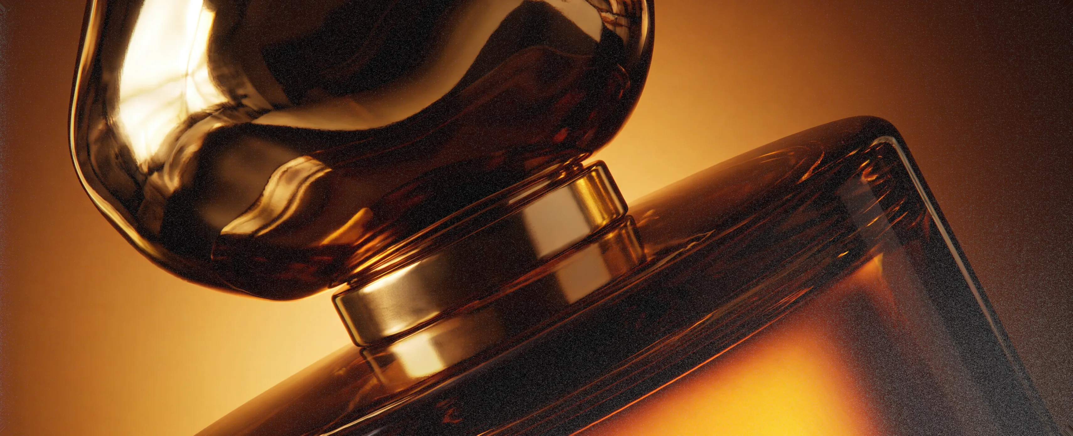 Celion — the sculptural gold perfume bottle in close-up on a warm amber set