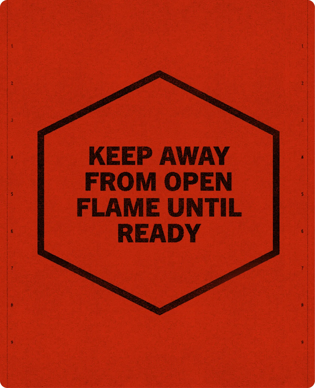 Heatwork: a red board printed with a black hexagon outline enclosing the words keep away from open flame until ready