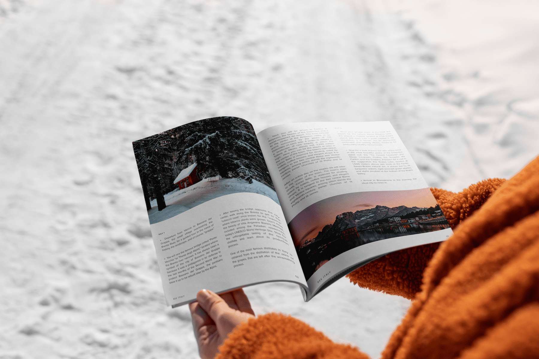 person reading an informative magazine in about Italy. Snow background