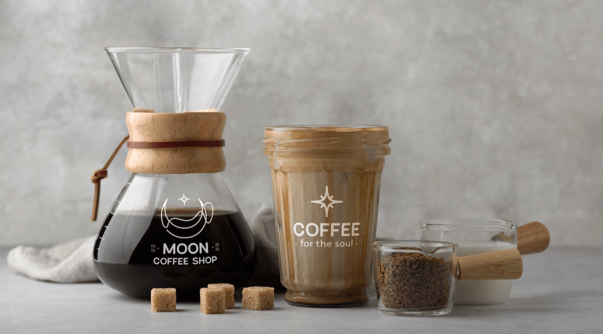 filter coffee maker, cup of coffee and milk powder coffee measures displayed on table