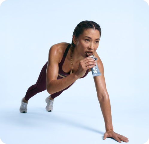 Athlete in plank pose eating a Skye protein bar, lifestyle imagery by CreativeWise AI Photo Studio